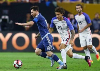 Argentina midfielder Lionel Messi (10) drives the ball downfield against United States defender Fabian Johnson (23) during the first half of a COPA America semi-final game at NRG Stadium, Tuesday, June 21, 2016, in Houston.  ( Jon Shapley / Houston Chronicle )