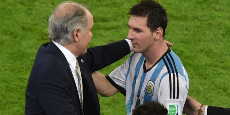 Argentina's coach Alejandro Sabella (L) celebrates with forward and captain Lionel Messi at the end of the Group F football match between Argentina and Bosnia Hercegovina at the Maracana Stadium in Rio De Janeiro during the 2014 FIFA World Cup on June 15, 2014. Argentina won 2-1. AFP PHOTO / YASUYOSHI CHIBA