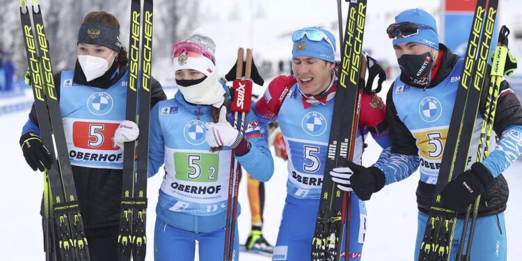 Russia's team stand together after winning the mixed relay race at the Biathlon World Cup in Oberhof, Germany, Sunday, Jan. 10, 2021. (AP Photo/Matthias Schrader)