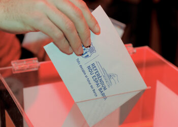 A Barcelona football club partner casts his ballot at the Camp Nou stadium in Barcelona on April 5, 2014 during a referendum by Barcelona FC partners for the renovation of the club's stadium. The polls opened at 0900 local ( 0700 GMT ) and four hours later 11,730 voting members of the118,580 had voted on wheter or not to expand capacity to 105,000 seats and a set roof over the existing structure. AFP PHOTO/ JOSEP LAGO        (Photo credit should read JOSEP LAGO/AFP via Getty Images)