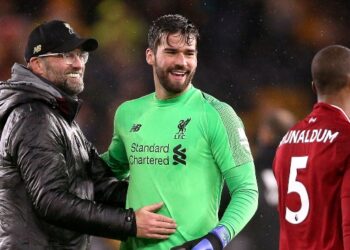 Liverpool manager Jurgen Klopp (left) goalkeeper Alisson Becker and Georginio Wijnaldum celebrate after the final whistle