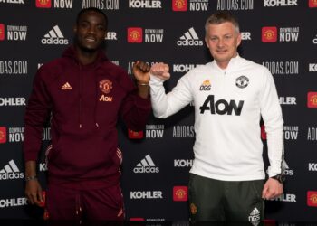 Eric Bailly of Manchester United poses with Ole Gunnar Solskjaer after signing a contract extension at Aon Training Complex on 26 April 2021. Photographer: Ash Donelon