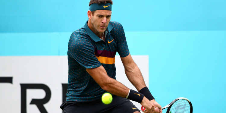 LONDON, ENGLAND - JUNE 19: Juan Martin del Potro of Argentina plays a backhand during his First Round Singles Match against Denis Shapovalov of Canada during day Three of the Fever-Tree Championships at Queens Club on June 19, 2019 in London, United Kingdom. (Photo by Clive Brunskill/Getty Images)
