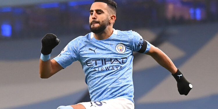 MANCHESTER, ENGLAND - NOVEMBER 28: Riyad Mahrez of Manchester City celebrates after scoring his team's first goal during the Premier League match between Manchester City and Burnley at Etihad Stadium on November 28, 2020 in Manchester, England. Sporting stadiums around the UK remain under strict restrictions due to the Coronavirus Pandemic as Government social distancing laws prohibit fans inside venues resulting in games being played behind closed doors. (Photo by Laurence Griffiths/Getty Images)