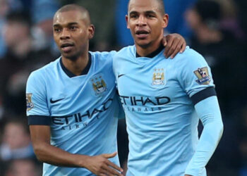 Manchester City's Fernandinho (left) celebrates scoring his side's second goal of the game with Fernando