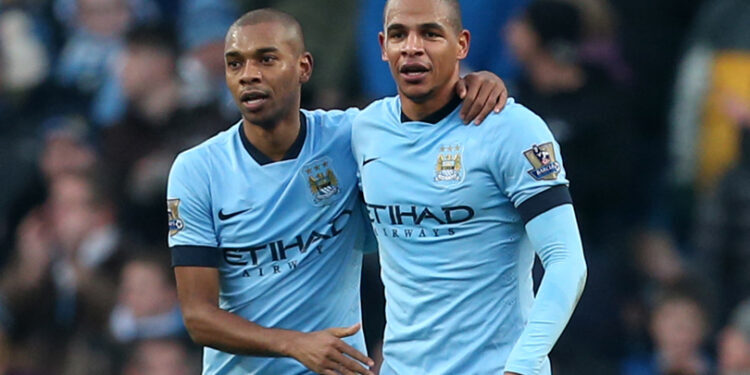 Manchester City's Fernandinho (left) celebrates scoring his side's second goal of the game with Fernando