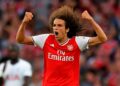 Arsenal's French midfielder Matteo Guendouzi celebrates after Arsenal's Gabonese striker Pierre-Emerick Aubameyang latched onto Guendouzi's pass to score their second goal to equalise 2-2 during the English Premier League football match between Arsenal and Tottenham Hotspur at the Emirates Stadium in London on September 1, 2019. (Photo by Ben STANSALL / AFP) / RESTRICTED TO EDITORIAL USE. No use with unauthorized audio, video, data, fixture lists, club/league logos or 'live' services. Online in-match use limited to 120 images. An additional 40 images may be used in extra time. No video emulation. Social media in-match use limited to 120 images. An additional 40 images may be used in extra time. No use in betting publications, games or single club/league/player publications. /         (Photo credit should read BEN STANSALL/AFP/Getty Images)