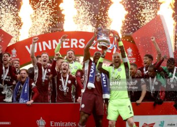 Leicester City's Wes Morgan (left) and Leicester City goalkeeper Kasper Schmeichel lift the trophy after the Emirates FA Cup Final at Wembley Stadium, London. Picture date: Saturday May 15, 2021. (Photo by Nick Potts/PA Images via Getty Images)