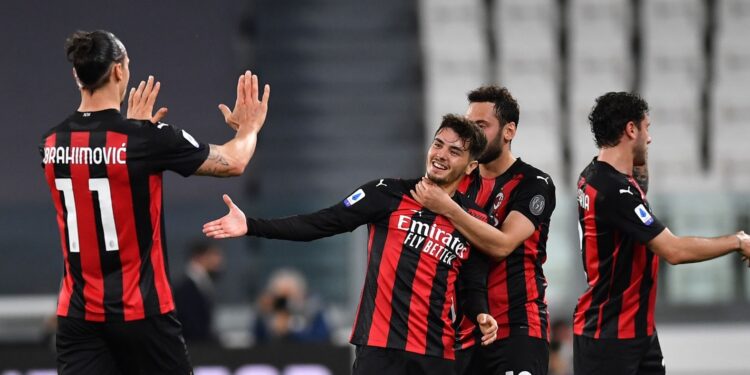 TURIN, ITALY - MAY 09: Brahim Diaz of A.C. Milan celebrates with Zlatan Ibrahimovic and Hakan Calhanoglu after scoring their side's first goal during the Serie A match between Juventus  and AC Milan at  on May 09, 2021 in Turin, Italy. Sporting stadiums around Italy remain under strict restrictions due to the Coronavirus Pandemic as Government social distancing laws prohibit fans inside venues resulting in games being played behind closed doors. (Photo by Valerio Pennicino/Getty Images)