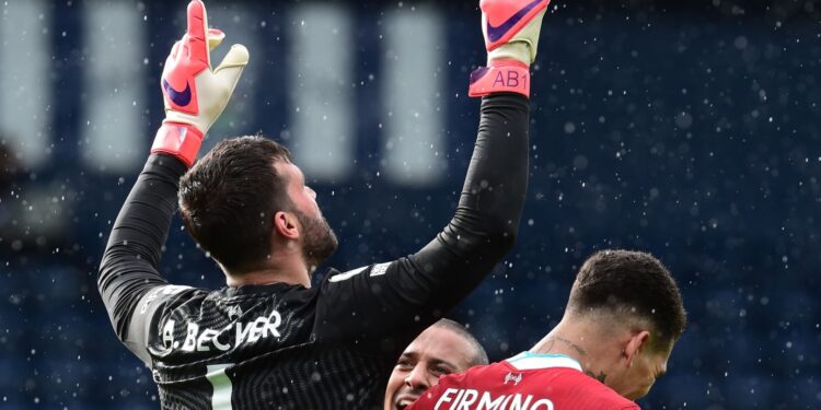 WEST BROMWICH, ENGLAND - MAY 16: (THE SUN OUT,THE SUN ON SUNDAY OUT) Alisson Becker of Liverpool celebrates  after scoring the second goal to win the game  during the Premier League match between West Bromwich Albion and Liverpool at The Hawthorns on May 16, 2021 in West Bromwich, England. (Photo by John Powell/Liverpool FC via Getty Images)