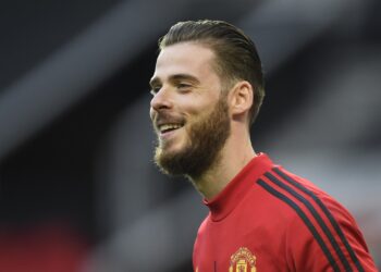 MANCHESTER, ENGLAND - JULY 13: David De Gea of Manchester United warms up prior to the Premier League match between Manchester United and Southampton FC at Old Trafford on July 13, 2020 in Manchester, England. Football Stadiums around Europe remain empty due to the Coronavirus Pandemic as Government social distancing laws prohibit fans inside venues resulting in all fixtures being played behind closed doors. (Photo by Peter Powell/Pool via Getty Images)