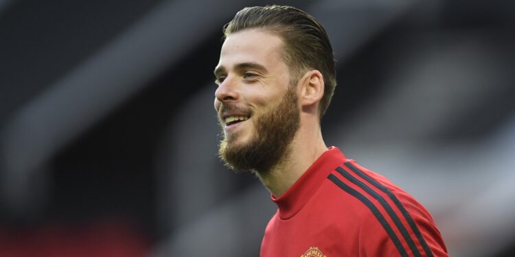 MANCHESTER, ENGLAND - JULY 13: David De Gea of Manchester United warms up prior to the Premier League match between Manchester United and Southampton FC at Old Trafford on July 13, 2020 in Manchester, England. Football Stadiums around Europe remain empty due to the Coronavirus Pandemic as Government social distancing laws prohibit fans inside venues resulting in all fixtures being played behind closed doors. (Photo by Peter Powell/Pool via Getty Images)