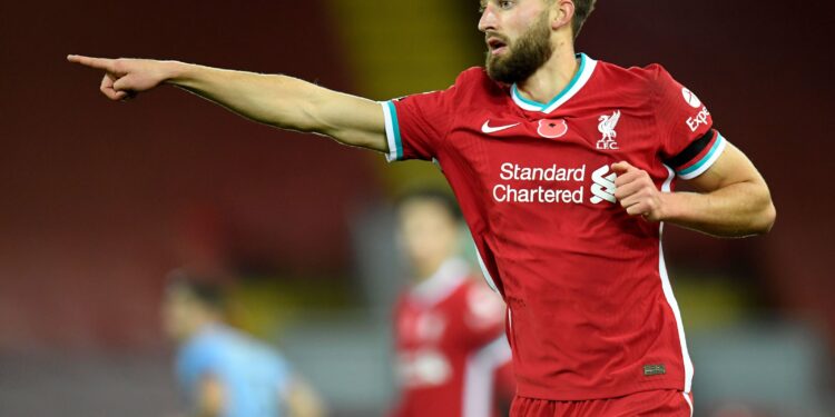 Liverpool's English defender Nathaniel Phillips gestures during the English Premier League football match between Liverpool and West Ham United at Anfield in Liverpool, north west England on October 31, 2020. (Photo by PETER POWELL / POOL / AFP) / RESTRICTED TO EDITORIAL USE. No use with unauthorized audio, video, data, fixture lists, club/league logos or 'live' services. Online in-match use limited to 120 images. An additional 40 images may be used in extra time. No video emulation. Social media in-match use limited to 120 images. An additional 40 images may be used in extra time. No use in betting publications, games or single club/league/player publications. /  (Photo by PETER POWELL/POOL/AFP via Getty Images)