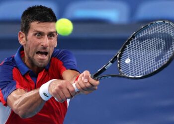 TOKYO, JAPAN - JULY 30: Novak Djokovic of Team Serbia plays a backhand during his Men's Singles Semifinal match against Alexander Zverev of Team Germany on day seven of the Tokyo 2020 Olympic Games at Ariake Tennis Park on July 30, 2021 in Tokyo, Japan. (Photo by Clive Brunskill/Getty Images)