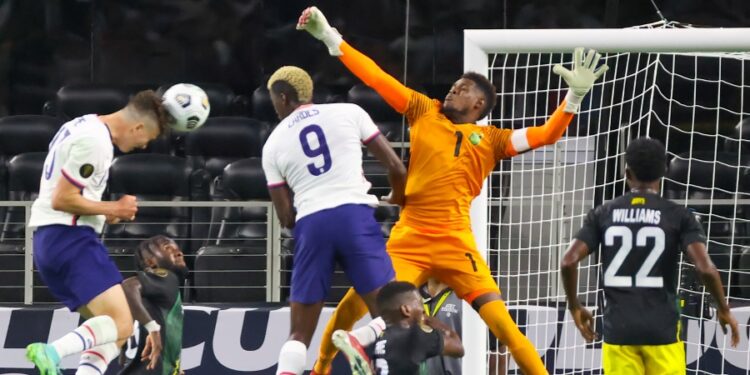 Jul 25, 2021; Arlington, Texas, USA; United States forward Matthew Hoppe (13) scores a goal past Jamaica goalkeeper Andre Blake (1) during the second half of a CONCACAF Gold Cup quarterfinal soccer match at AT&T Stadium. Mandatory Credit: Kevin Jairaj-USA TODAY Sports