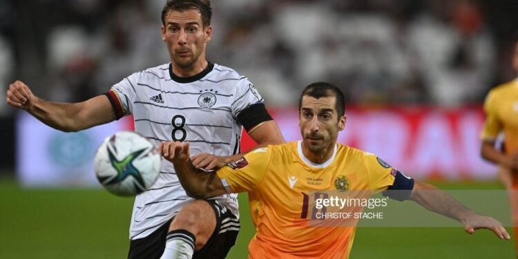 Germany's midfielder Leon Goretzka (L) and Armenia's midfielder Henrikh Mkhitaryan vie for the ball during the FIFA World Cup Qatar 2022 qualification Group J football match between Germany and Armenia, in Stuttgart, on September 5, 2021. (Photo by CHRISTOF STACHE / AFP) (Photo by CHRISTOF STACHE/AFP via Getty Images)
