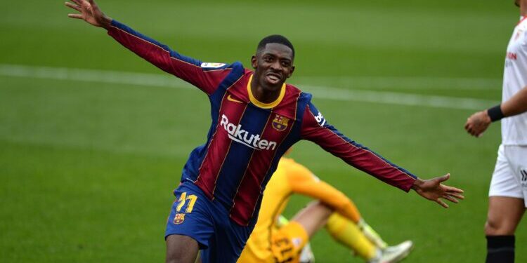 Barcelona's French forward Ousmane Dembele celebrates after scoring a goal during the Spanish league football match between Sevilla FC and FC Barcelona at the Ramon Sanchez Pizjuan stadium in Seville on February 27, 2021. (Photo by CRISTINA QUICLER / AFP) (Photo by CRISTINA QUICLER/AFP via Getty Images)