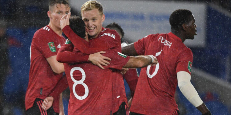 Manchester United's Spanish midfielder Juan Mata celebrates with teammates after he  scores his team's second goal during the English League Cup fourth round football match between Brighton and Hove Albion and Manchester United at the American Express Community Stadium in Brighton, southern England on September 30, 2020. (Photo by Andy Rain / POOL / AFP) / RESTRICTED TO EDITORIAL USE. No use with unauthorized audio, video, data, fixture lists, club/league logos or 'live' services. Online in-match use limited to 120 images. An additional 40 images may be used in extra time. No video emulation. Social media in-match use limited to 120 images. An additional 40 images may be used in extra time. No use in betting publications, games or single club/league/player publications. /  (Photo by ANDY RAIN/POOL/AFP via Getty Images)