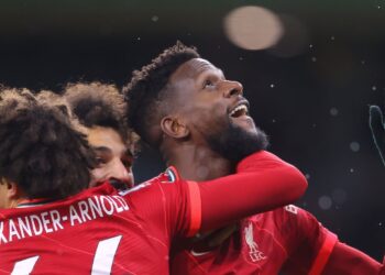 WOLVERHAMPTON, ENGLAND - DECEMBER 04:  Divock Origi of Liverpool celebrates after scoring the winning goal during the Premier League match between Wolverhampton Wanderers and Liverpool at Molineux on December 04, 2021 in Wolverhampton, England. (Photo by James Gill - Danehouse/Getty Images)