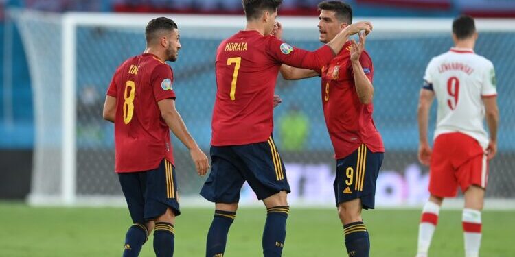 SEVILLE, SPAIN - JUNE 19: Alvaro Morata of Spain celebrates with Koke and Gerard Moreno after scoring their side's first goal during the UEFA Euro 2020 Championship Group E match between Spain and Poland at Estadio La Cartuja on June 19, 2021 in Seville, Spain. (Photo by David Ramos/Getty Images)