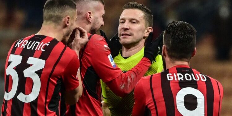 (From L) AC Milan's Bosnian midfielder Rade Krunic, AC Milan's Croatian forward Ante Rebic and AC Milan's French forward Olivier Giroud (R) react after Italian referee Marco Serra's (C) decision not to grant a goal to AC Milan, during the Italian Serie A football match between AC Milan and Spezia on January 17, 2022 at the San Siro stadium in Milan. (Photo by MIGUEL MEDINA / AFP) (Photo by MIGUEL MEDINA/AFP via Getty Images)