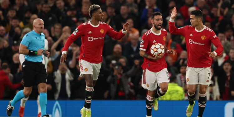 MANCHESTER, ENGLAND - OCTOBER 20: Marcus Rashford of Manchester United celebrates after scoring a goal to make it 1-2 during the UEFA Champions League group F match between Manchester United and Atalanta at Old Trafford on October 20, 2021 in Manchester, United Kingdom. (Photo by Matthew Ashton - AMA/Getty Images)
