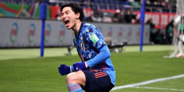 SAITAMA, JAPAN - FEBRUARY 01: Takumi Minamino of Japan celebrates scoring his side's first goal during the FIFA World Cup Asian Qualifier Final Round Group B match between Japan and Saudi Arabia at Saitama Stadium on February 1, 2022 in Saitama, Japan. (Photo by Koji Watanabe/Getty Images)