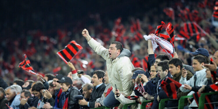 Milan, ITALY: AC Milan supporters celebrate defeating Manchester United in the Champions League second leg semi-final football match at Milan's San Siro Stadium, 02 May 2007. AC Milan won the match 3-0 qualifying for the final in Athens against Liverpool  23 May.  AFP PHOTO / FILIPPO MONTEFORTE (Photo credit should read FILIPPO MONTEF0RTE/AFP/Getty Images)
