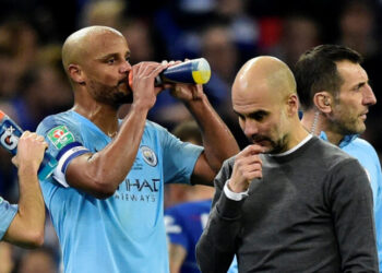 Soccer Football - Carabao Cup Final - Manchester City v Chelsea - Wembley Stadium, London, Britain - February 24, 2019 Manchester City's Vincent Kompany and manager Pep Guardiola REUTERS/Rebecca Naden EDITORIAL USE ONLY. No use with unauthorized audio, video, data, fixture lists, club/league logos or "live" services. Online in-match use limited to 75 images, no video emulation. No use in betting, games or single club/league/player publications. Please contact your account representative for further details.