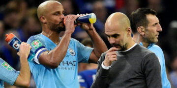 Soccer Football - Carabao Cup Final - Manchester City v Chelsea - Wembley Stadium, London, Britain - February 24, 2019 Manchester City's Vincent Kompany and manager Pep Guardiola REUTERS/Rebecca Naden EDITORIAL USE ONLY. No use with unauthorized audio, video, data, fixture lists, club/league logos or "live" services. Online in-match use limited to 75 images, no video emulation. No use in betting, games or single club/league/player publications. Please contact your account representative for further details.