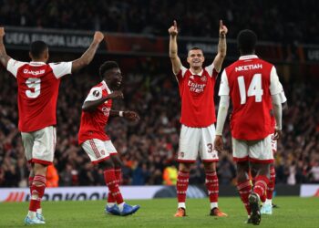 Arsenal's Swiss midfielder Granit Xhaka (2nd R) celebrates with teammates after scoring the opening goal of the UEFA Europa League Group A football match between Arsenal and PSV Eindhoven at The Arsenal Stadium in London, on October 20, 2022. (Photo by ADRIAN DENNIS / AFP) (Photo by ADRIAN DENNIS/AFP via Getty Images)