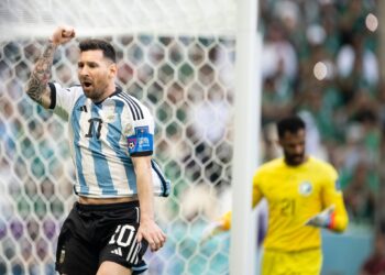 LUSAIL CITY, QATAR - NOVEMBER 22: Lionel Messi of Argentina celebrates after scoring the opening goal from the penalty spot during the FIFA World Cup Qatar 2022 Group C match between Argentina and Saudi Arabia at Lusail Stadium on November 22, 2022 in Lusail City, Qatar. (Photo by Sebastian Frej/MB Media/Getty Images)