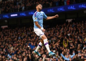 MANCHESTER, ENGLAND - NOVEMBER 23: Riyad Mahrez of Manchester City celebrates after scoring his team's second goal during the Premier League match between Manchester City and Chelsea FC at Etihad Stadium on November 23, 2019 in Manchester, United Kingdom. (Photo by Laurence Griffiths/Getty Images)