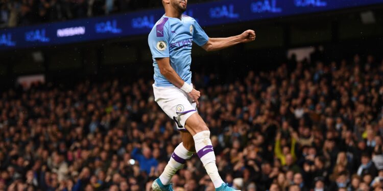 MANCHESTER, ENGLAND - NOVEMBER 23: Riyad Mahrez of Manchester City celebrates after scoring his team's second goal during the Premier League match between Manchester City and Chelsea FC at Etihad Stadium on November 23, 2019 in Manchester, United Kingdom. (Photo by Laurence Griffiths/Getty Images)