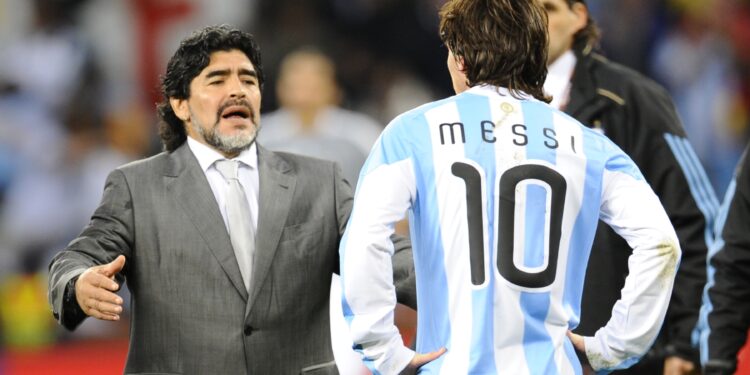 Argentina's coach Diego Maradona (L) looks dejected in front of Argentina's striker Lionel Messi after they lost the 2010 World Cup quarter-final football match Argentina vs. Germany on July 3, 2010 at Green Point stadium in Cape Town. Germany qualified for the semi-finals.  NO PUSH TO MOBILE / MOBILE USE SOLELY WITHIN EDITORIAL ARTICLE -    AFP PHOTO / DANIEL GARCIA (Photo credit should read DANIEL GARCIA/AFP via Getty Images)