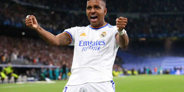 MADRID, SPAIN - MAY 04:  Rodrygo of Real Madrid celebrates after they win a penalty during the UEFA Champions League Semi Final Leg Two match between Real Madrid and Manchester City at Estadio Santiago Bernabeu on May 04, 2022 in Madrid, Spain. (Photo by Alex Livesey - Danehouse/Getty Images)