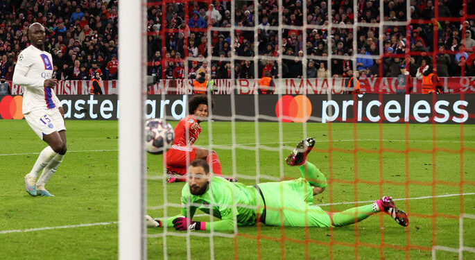 MUNICH, GERMANY - MARCH 08: Serge Gnabry of FC Bayern Munich scores the team's second goal past Gianluigi Donnarumma of Paris Saint-Germain during the UEFA Champions League round of 16 leg two match between FC Bayern München and Paris Saint-Germain at Allianz Arena on March 08, 2023 in Munich, Germany. (Photo by Alexander Hassenstein/Getty Images)