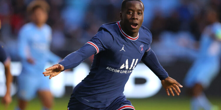 MANCHESTER, ENGLAND - NOVEMBER 24:  Djeidi Gassama of Paris Saint-Germain celebrates after scoring the opening goal during the UEFA Youth League match between Manchester City and Paris Saint-Germain at Manchester City Football Academy on November 24, 2021 in Manchester, England. (Photo by Alex Livesey - Danehouse/Getty Images)