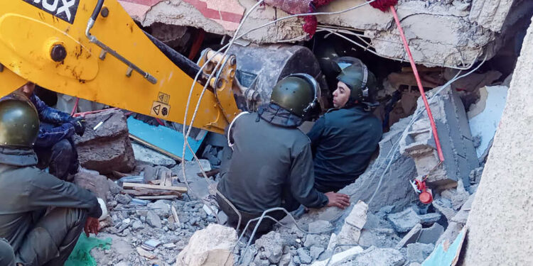 Rescue workers search for survivors in a collapsed house in Moulay Brahim, Al Haouz province, on September 9, 2023, after an earthquake. Morocco's deadliest earthquake in decades has killed at least 820 people, officials said on September 9, causing widespread damage and sending terrified residents and tourists scrambling to safety in the middle of the night. (Photo by Fadel SENNA / AFP) (Photo by FADEL SENNA/AFP via Getty Images)