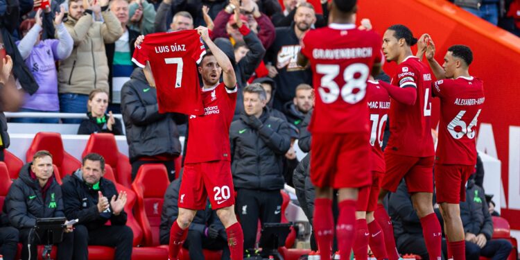 LIVERPOOL, ENGLAND - Sunday, October 29, 2023: Liverpool's Diogo Jota celebrates after scoring the opening goal by displaying the shirt of team-mate Luis Díaz, who's parents were kidnaped in Colombia, during the FA Premier League match between Liverpool FC and Nottingham Forest FC at Anfield. (Photo by David Rawcliffe/Propaganda)