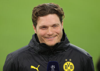 DORTMUND, GERMANY - APRIL 14: Edin Terzic, Head Coach of Borussia Dortmund reacts as he is interviewed prior to the UEFA Champions League Quarter Final Second Leg match between Borussia Dortmund and Manchester City at Signal Iduna Park on April 14, 2021 in Dortmund, Germany. Sporting stadiums around Germany remain under strict restrictions due to the Coronavirus Pandemic as Government social distancing laws prohibit fans inside venues resulting in games being played behind closed doors.  (Photo by Friedemann Vogel - Pool/Getty Images)