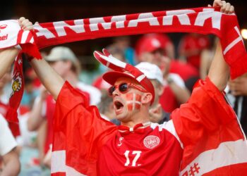 BAKU, AZERBAIJAN - JULY 03: A Denmark fan raises a scarf as they show their support prior to the UEFA Euro 2020 Championship Quarter-final match between Czech Republic and Denmark at Baku Olimpiya Stadionu on July 03, 2021 in Baku, Azerbaijan. (Photo by Valetin Ogirenko - Pool/Getty Images)