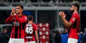 MILAN, ITALY - APRIL 19: Olivier Giroud and Marko Lazetic of AC Milan  cheer the fans afte the Coppa Italia Semi Final 2nd Leg match between FC Internazionale v AC Milan at Giuseppe Meazza Stadium on April 19, 2022 in Milan, Italy. (Photo by Pier Marco Tacca/AC Milan via Getty Images)
