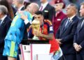 EAST RUTHERFORD, NEW JERSEY - JULY 19: Pedro Porro #12 of Spain kisses the FIFA World Cup Winner's Trophy as he receives the medal following the FIFA World Cup 2026 Final match between Spain and Argentina at New York New Jersey Stadium on July 19, 2026 in East Rutherford, New Jersey. (Photo by Dan Mullan/Getty Images)