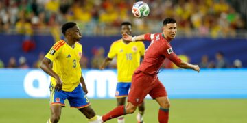 MIAMI GARDENS, FLORIDA - JUNE 27: Cristiano Ronaldo #7 of Portugal is challenged by Jhon Lucumi #3 of Colombia during the FIFA World Cup 2026 Group K match between Colombia and Portugal at Miami Stadium on June 27, 2026 in Miami Gardens, Florida. (Photo by Michael Reaves/Getty Images)