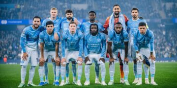MANCHESTER, ENGLAND - OCTOBER 14: The Manchester City starting XI stand together for a team photo ahead of the UEFA Champions League 2026/27 league phase MD2 match between Manchester City and Paris Saint-Germain at the Etihad Stadium on October 14, 2026 in Manchester, England. (Photo by Declan Lloyd/Manchester City FC via Getty Images)